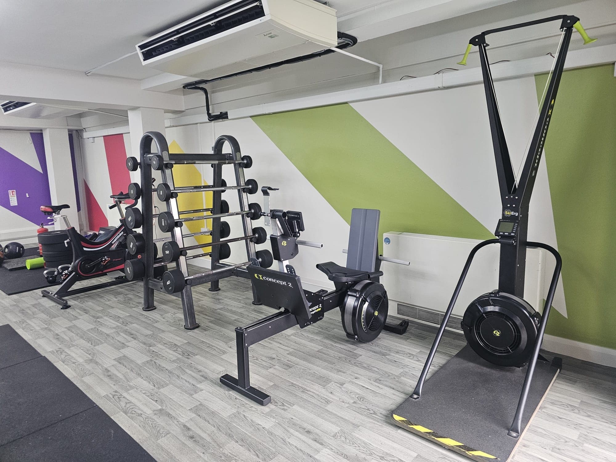 Gym floor with green and yellow geometric wall graphics