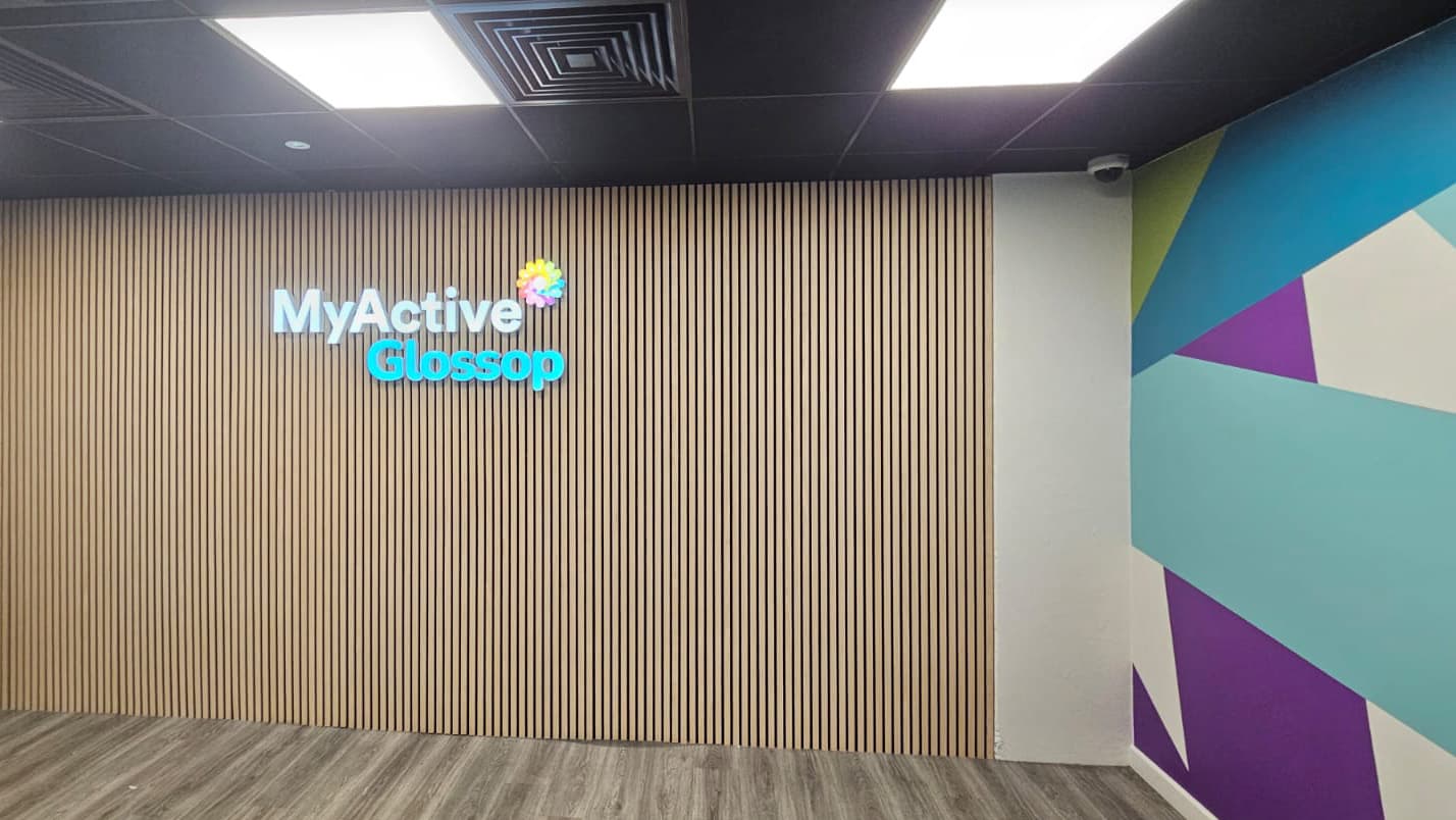 MyActive Glossop illuminated logo on slatted panel