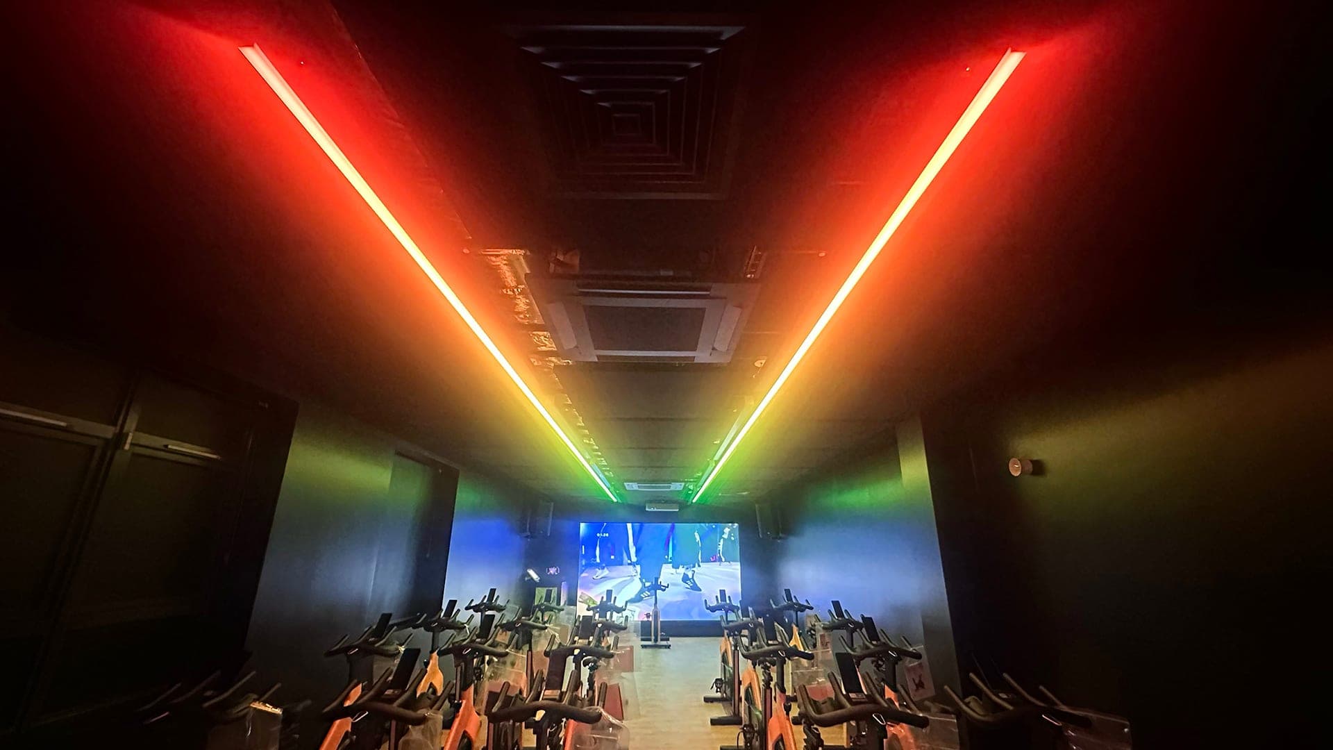 MyActive Leek cycle studio with RGB audio-reactive light lines and Les Mills screen