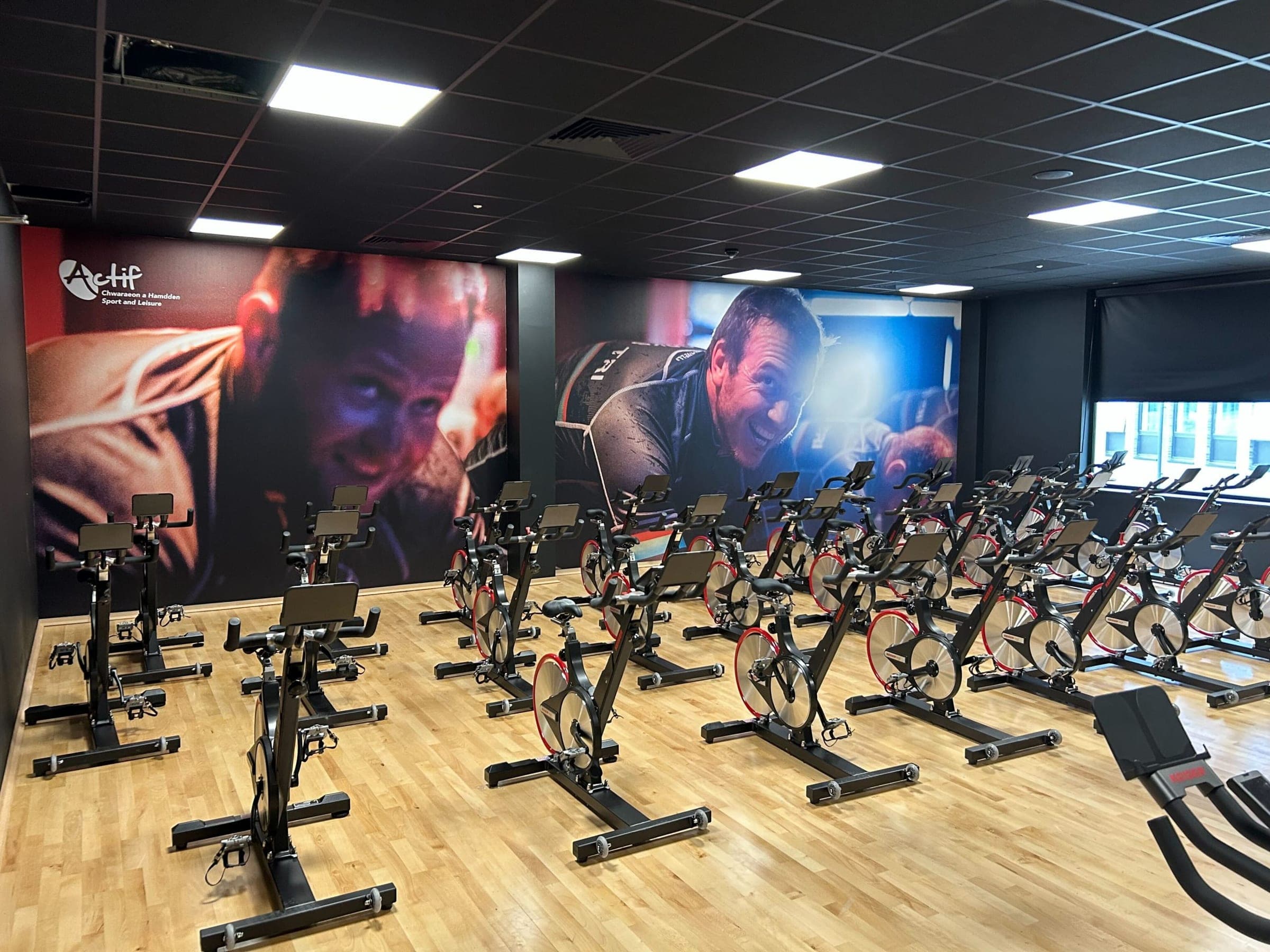 Pentre Awel spin studio with dramatic branded wall murals