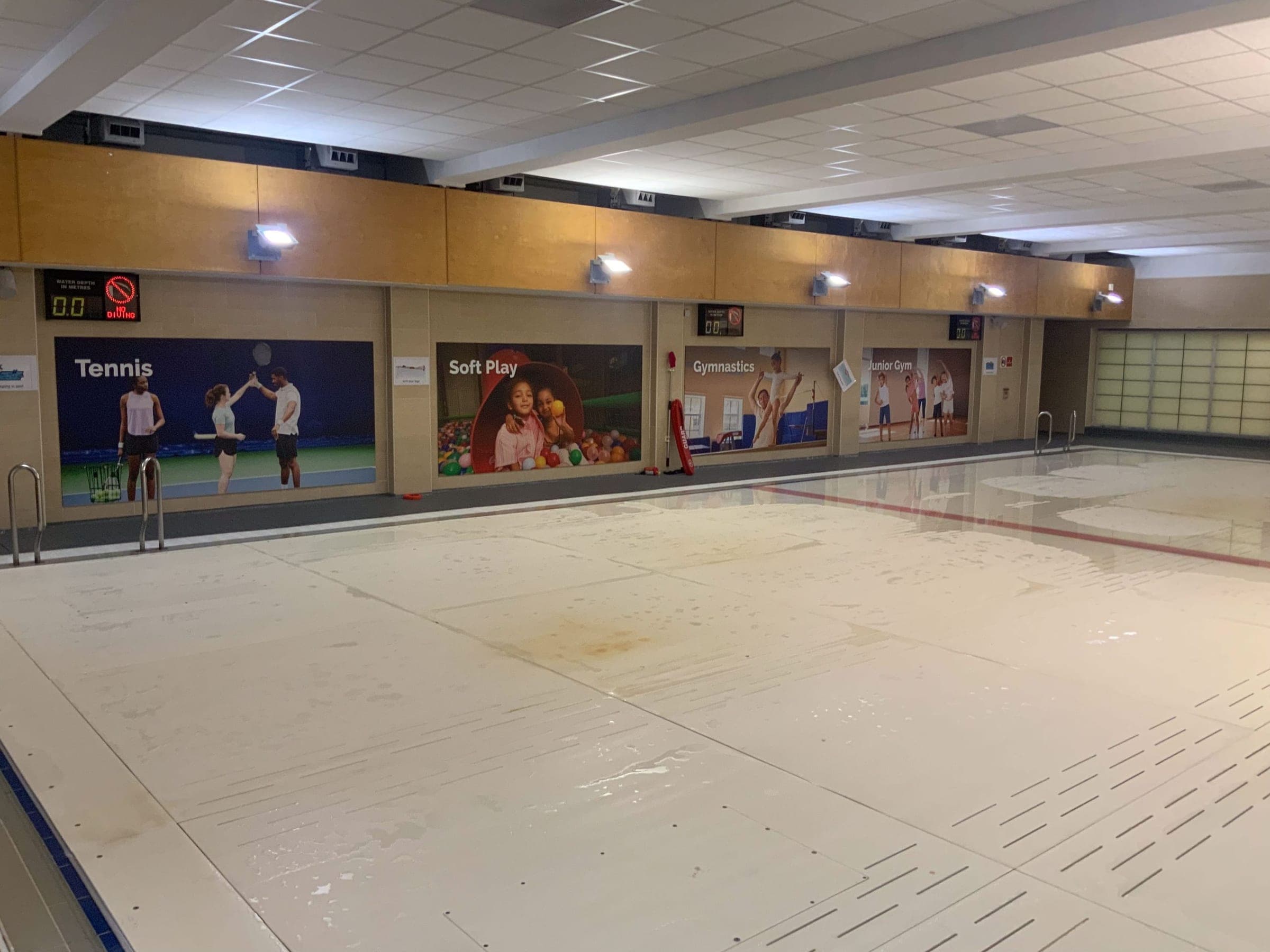 Indoor sports hall with branded wall panels for Tennis, Soft Play, Gymnastics and Junior Gym