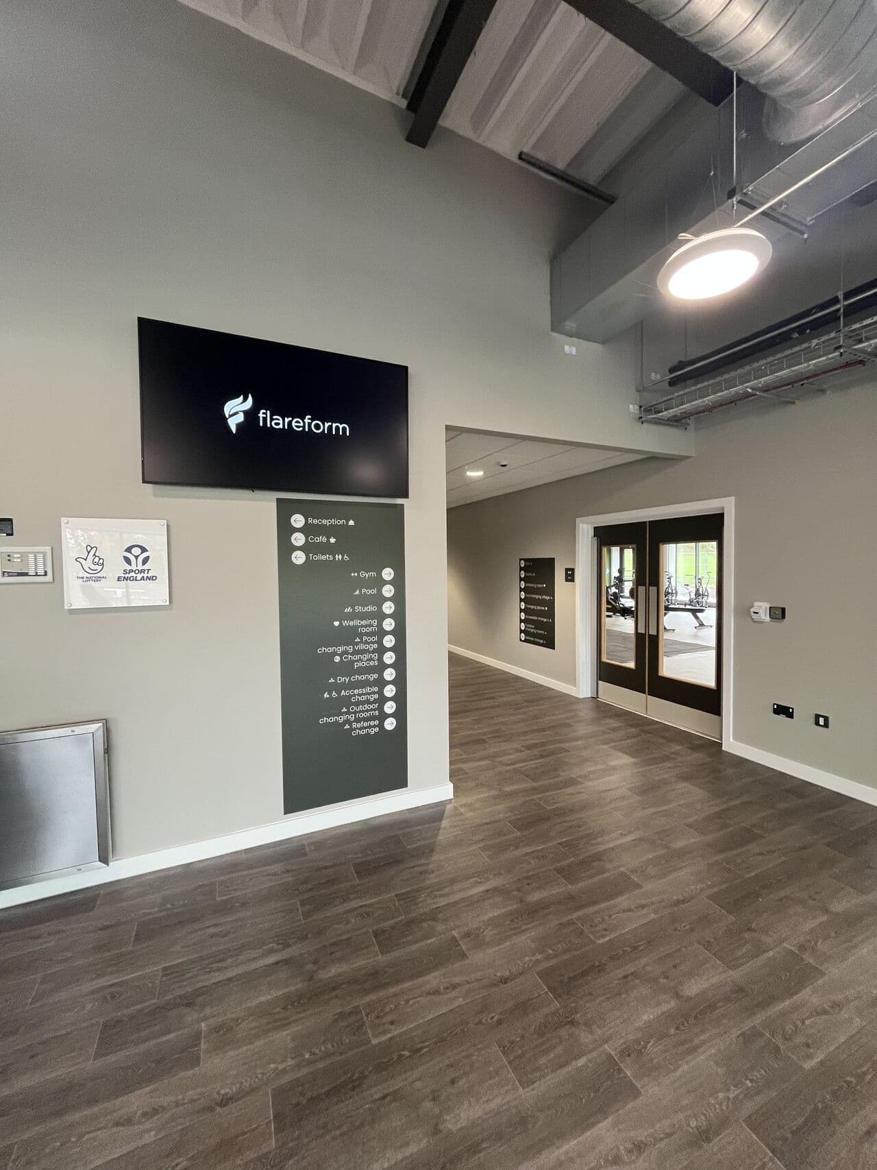 Reception lobby with Flareform digital display screen and wayfinding column