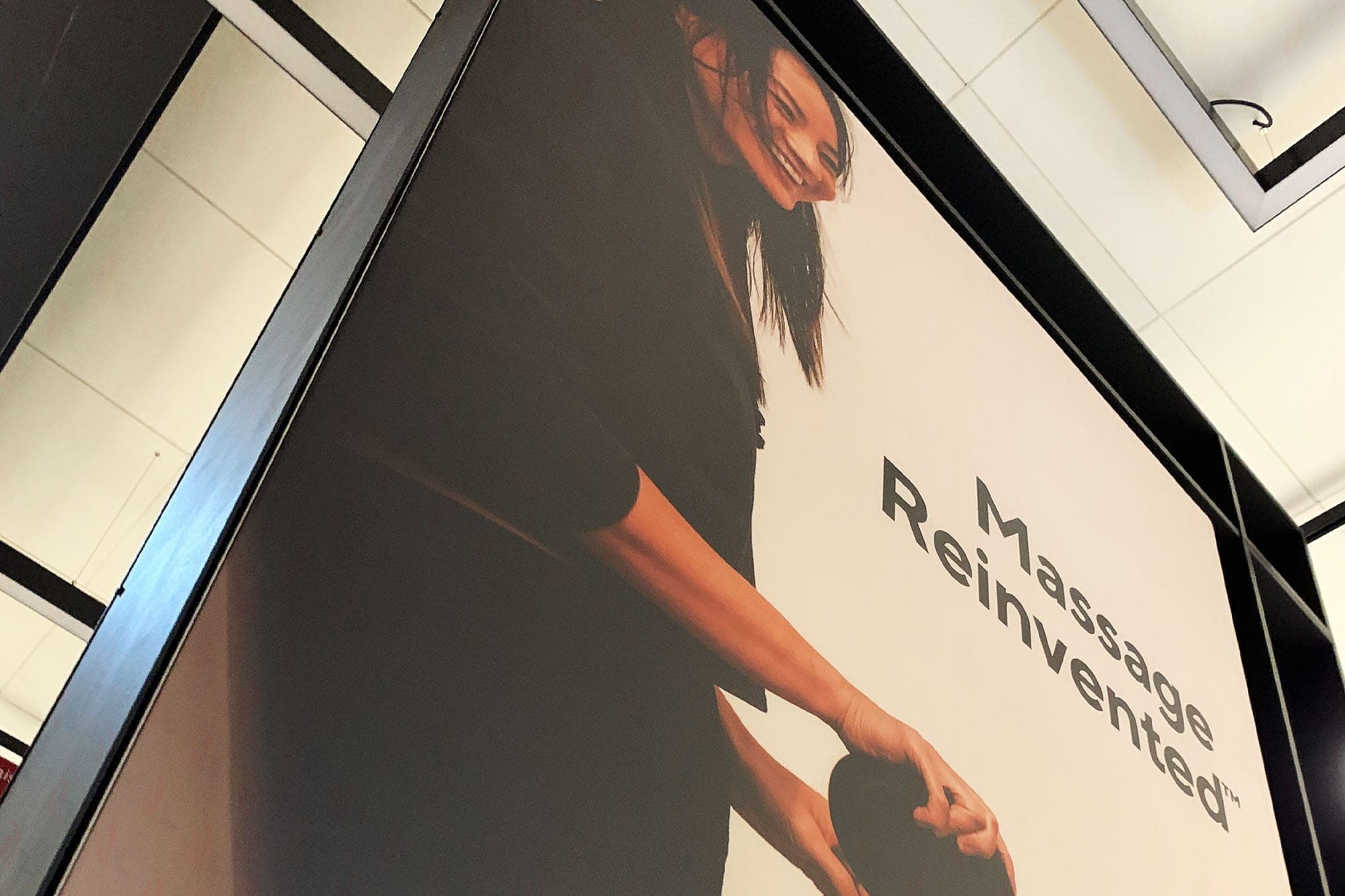 Large-format Therabody Massage Reinvented backlit lightbox panel in-store
